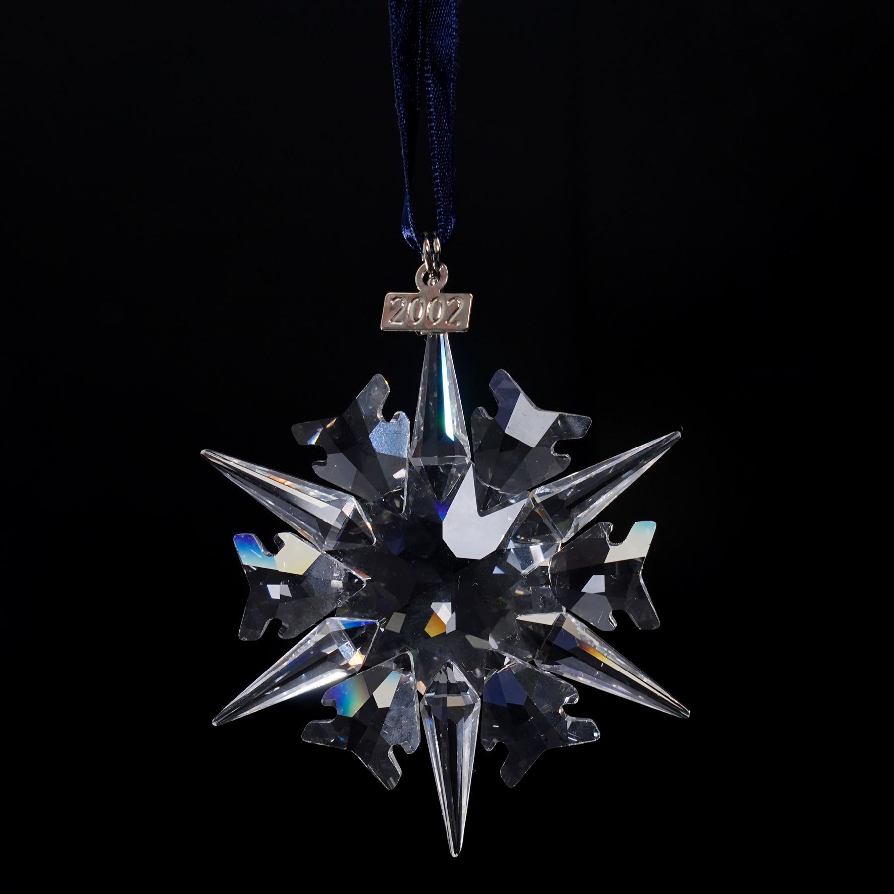 Nine Swarovski crystal snowflake Christmas ornaments, comprising years 1999-2005, 2010 and 2011, some with certificates, boxed (9)