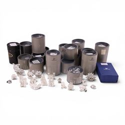 Collection of Swarovski crystal ornaments including train set, paperweight, towered buildi...