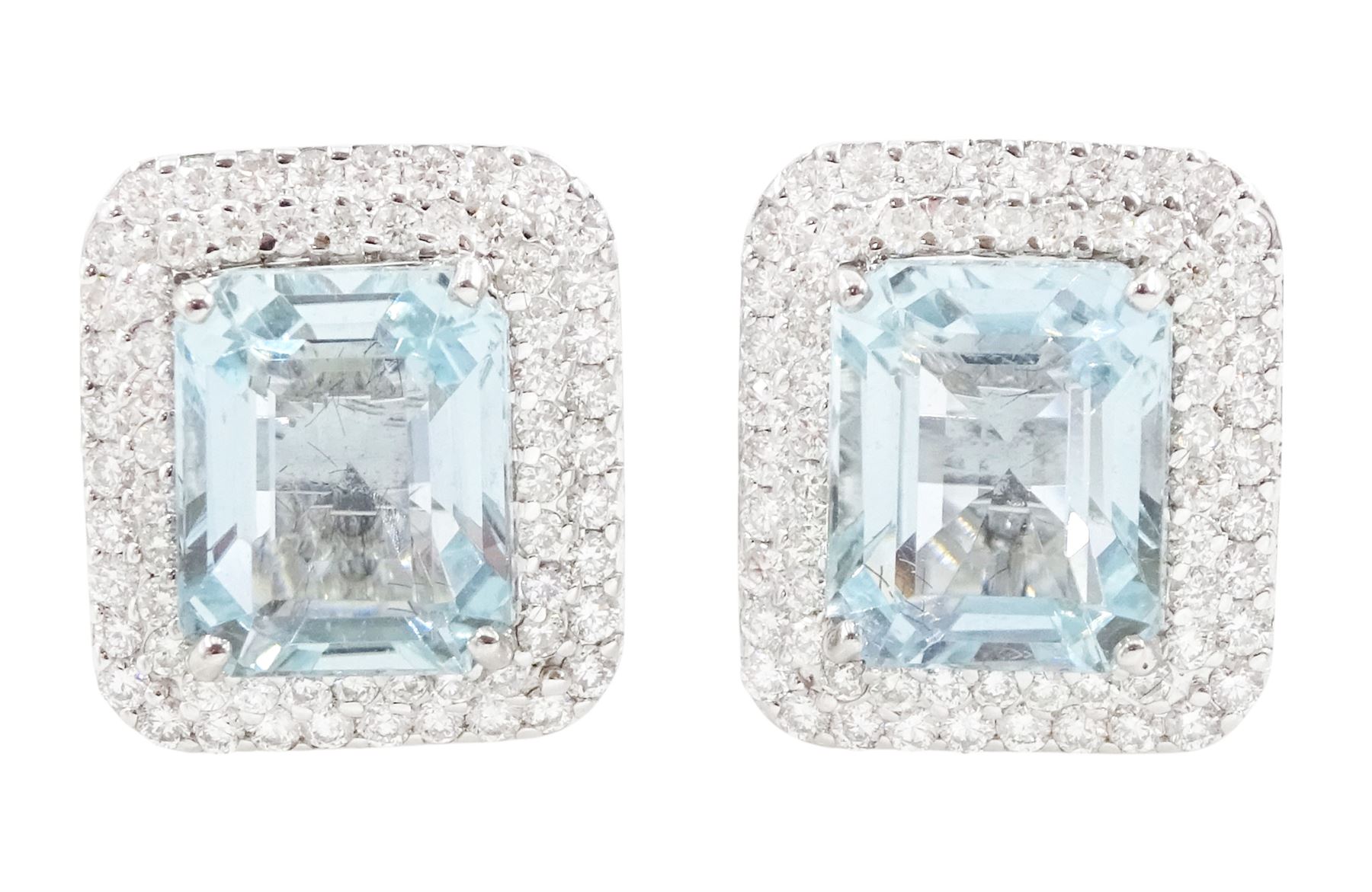 Pair of 18ct white gold aquamarine and diamond cluster earrings, each stud set with a single octagonal cut aquamarine and two rows of round brilliant cut diamonds, total aquamarine weight approx 6.30 carat, total diamond weight approx 1.00 carat