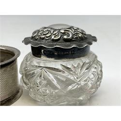 Two silver napkin rings, silver spoon with thistle top terminal, two silver handled butter knives, and small glass jar with silver cover, all hallmarked, approximate weighable silver 53.7 grams