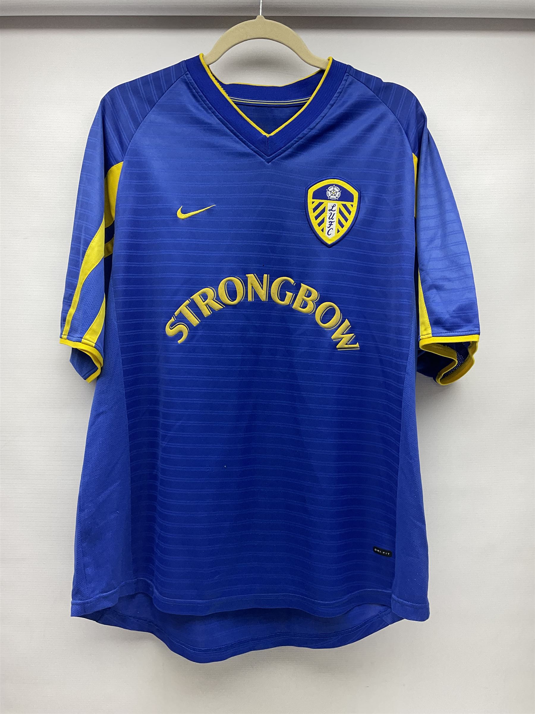 Fourteen items of replica sporting clothing including Leeds United football club shirts, England jerseys etc