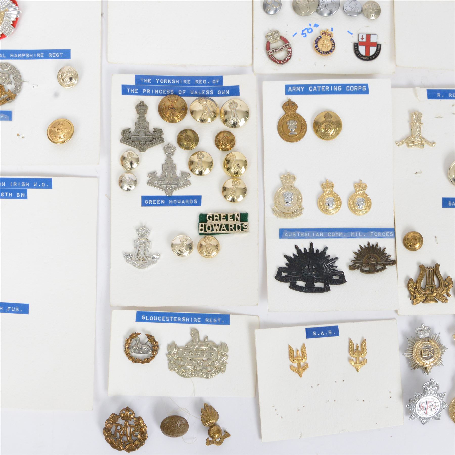 Collection of military cap badges, buttons and similar, including examples for Royal Army Medical Corps, Royal Army Pay Corps, Royal Engineers etc 