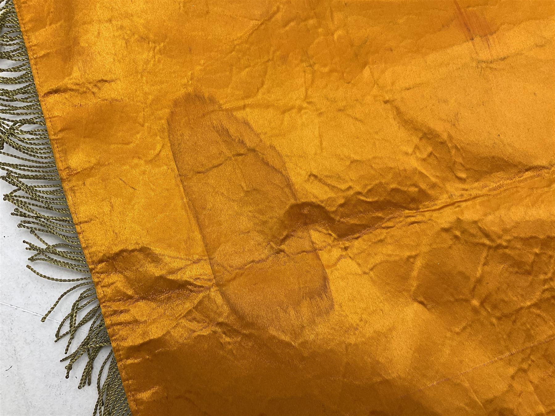 Two replica German Luftwaffe trumpet banners, one heavily silver wire embroidered with Luftwaffe eagle in a wreath, on an amber, white and black rayed background, , with silver wire tasselled border and four leather hanging loops, approx. 50 x 49cm; the other slightly larger heavily gold wire embroidered with the Luftwaffe eagle on a plain amber ground with gold wire tasselled border and two hanging loops (2)