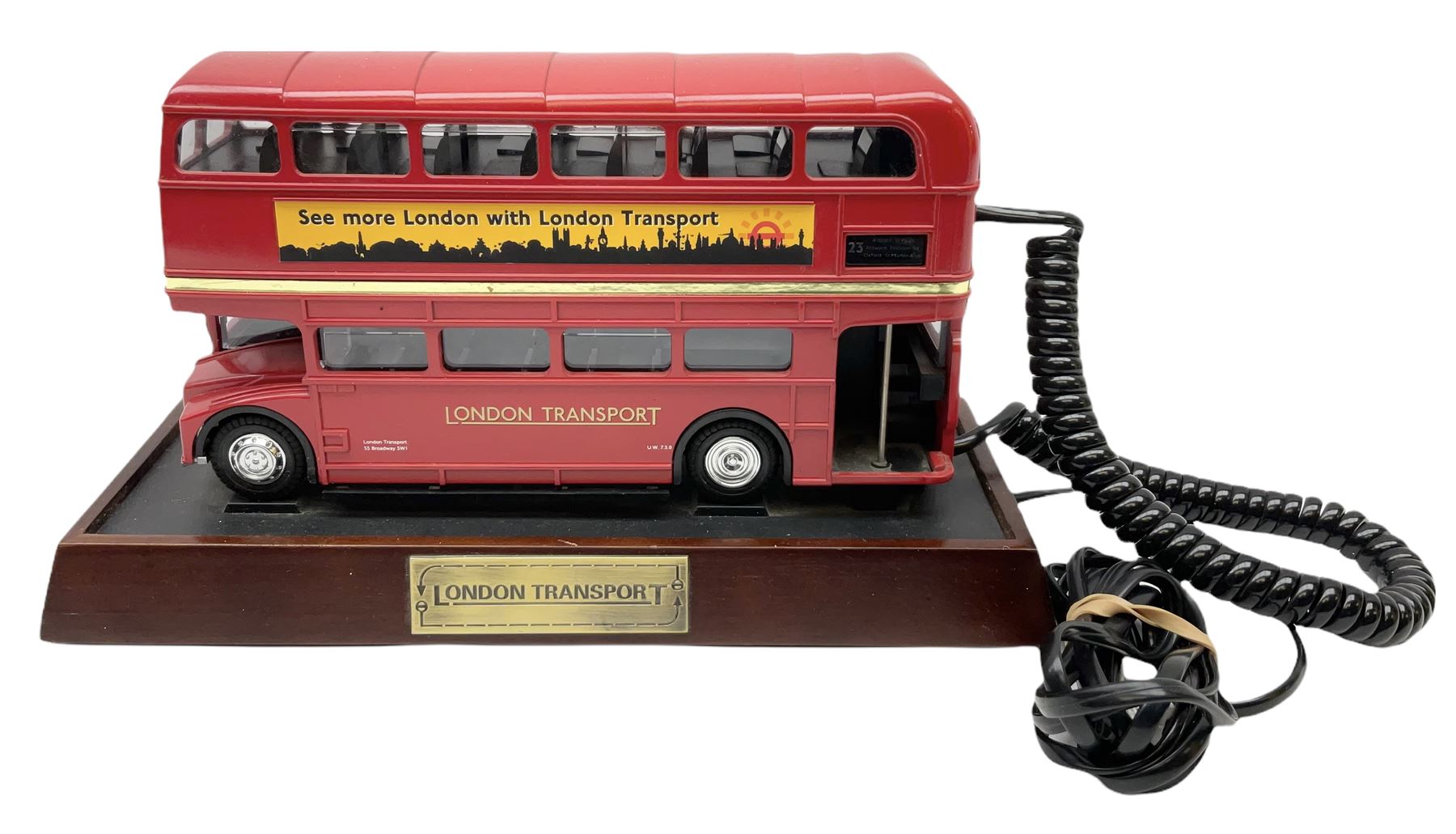 Novelty telephone in the form of a London Routemaster bus, c1997, fitted on wooden plinth with modern connection L25.5cm