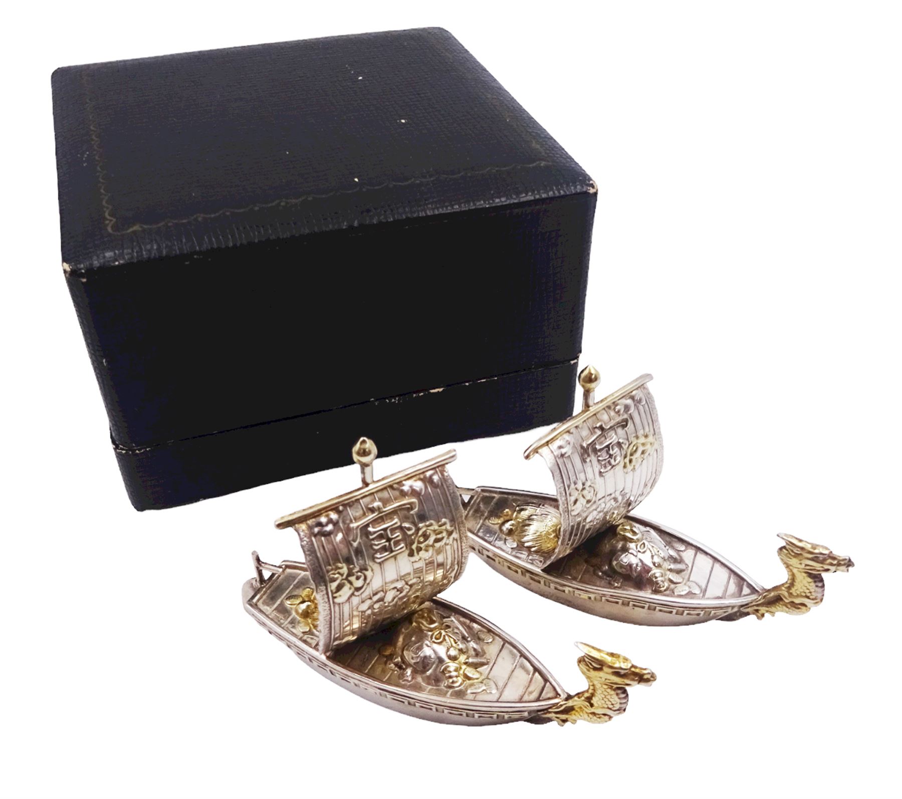 Pair of 20th century Japanese silver novelty cruets, modelled in the form of Viking long ships, marked Sterling Japan, contained within a fitted case, approximate silver weight 1.18 ozt (36.6 grams)