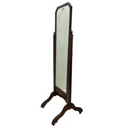 20th century mahogany framed cheval dressing mirror, rectangular bevelled plate with canted top corners, fluted uprights on splayed end supports and castors