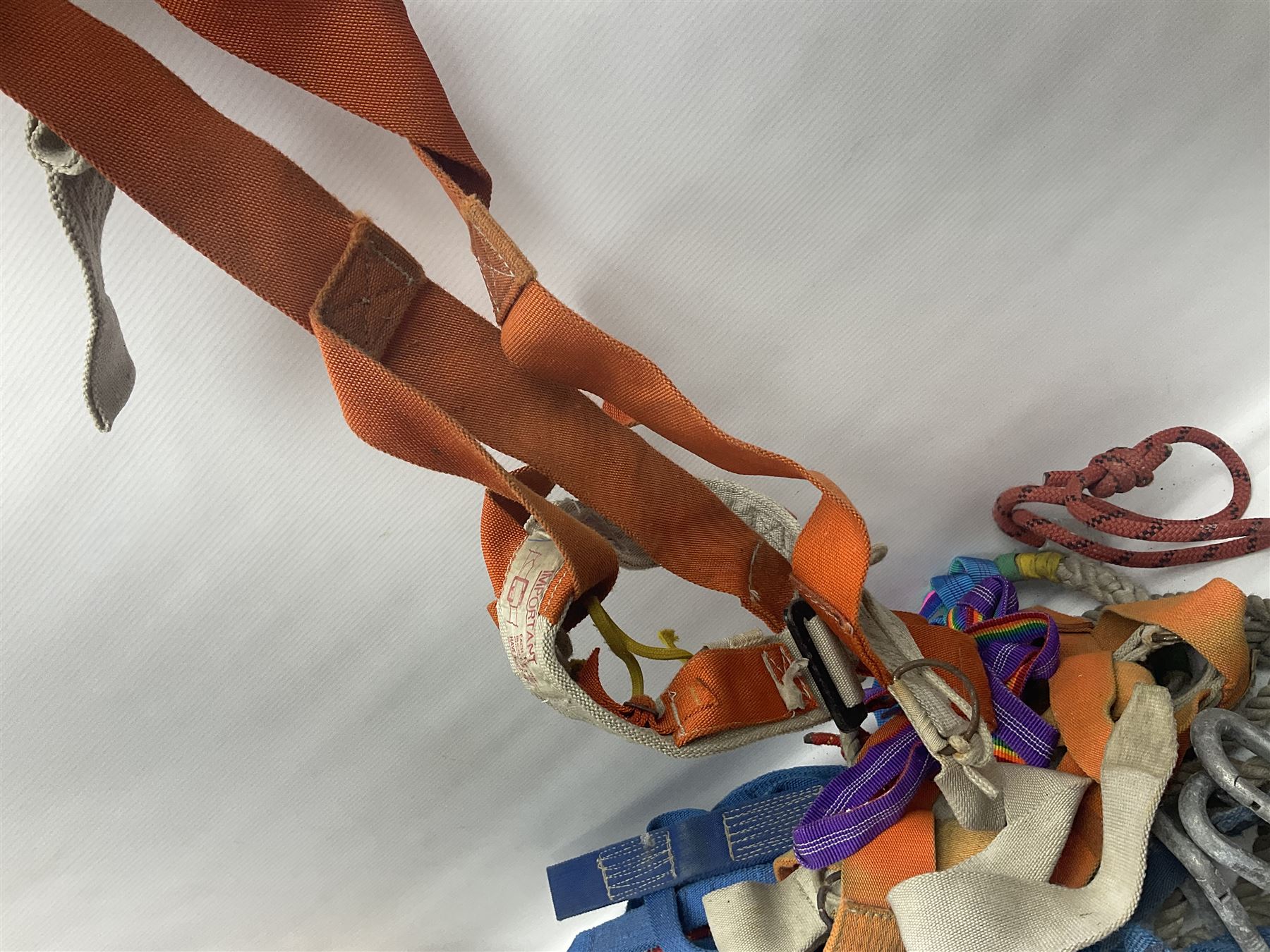 Collection of 1960s/70s climbing equipment including two original Hamish McInnes Pterodactyl ice axes, Joe Brown helmet, carabiners, ropes and wires etc