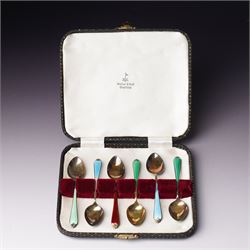Set of six silver gilt coffee spoons with coloured enamel stems, cased Birmingham 1962 in ...