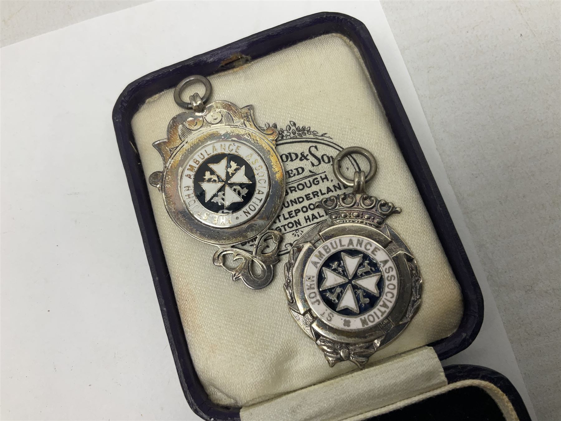 Four St John's silver fobs, together with two silver Directors Ambulance shield fobs and two other St Johns items 