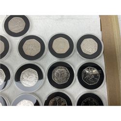 Thirty-seven commemorative fifty pence coins, including 2011 wrestling, other Olympics, Beatrix Potter etc, housed in capsules