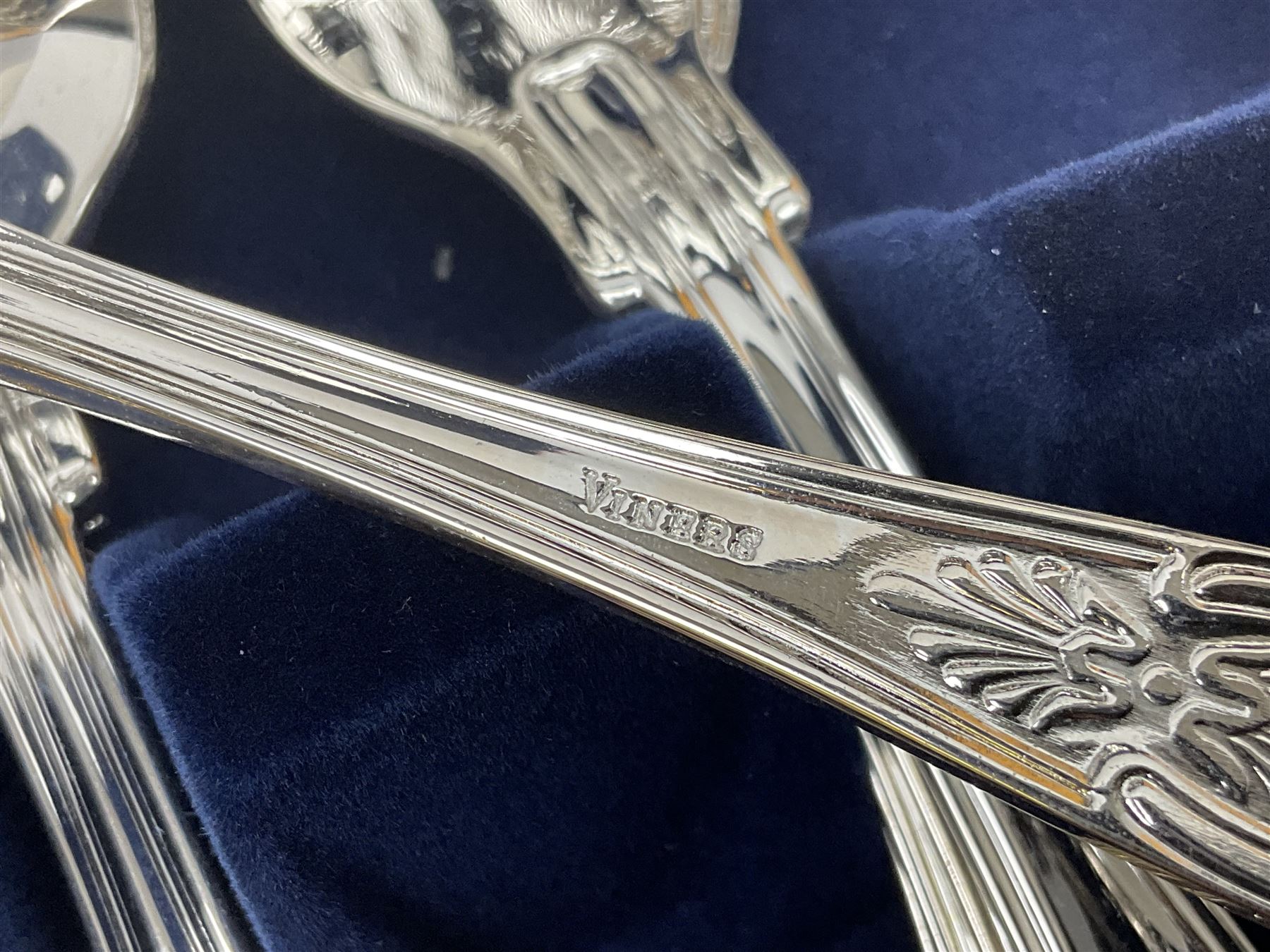 Viners Emassy canteen of Sheffield silver plated cutlery, 58 pieces, comprising eight table knives, dessert knives, dessert spoons, teaspoons, table forks, dessert forks, soup spoons, and two table spoons, housed in case with hinged lift up lid raised on four feet, L45cm