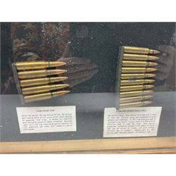 SECTION 1 FIRE-ARMS CERTIFICATE REQUIRED - Two cased specimen displays of annotated ammunition/cartridges - one entitled 'First World War Collection' containing twenty items including 7.63 Mauser, 7.65 Luger, .303, 7.62 x 54R Russian long, 455 Mk.II lead, 455 Auto etc; the other with sixteen items/clips including Musket cartridge, .577 Snider-Enfield, .577/45 Martini Henry, .303 Enfield Magazine, 7.62 Charger Clip, Specialised .303 rounds etc; largest case 41 x 76cm (2)