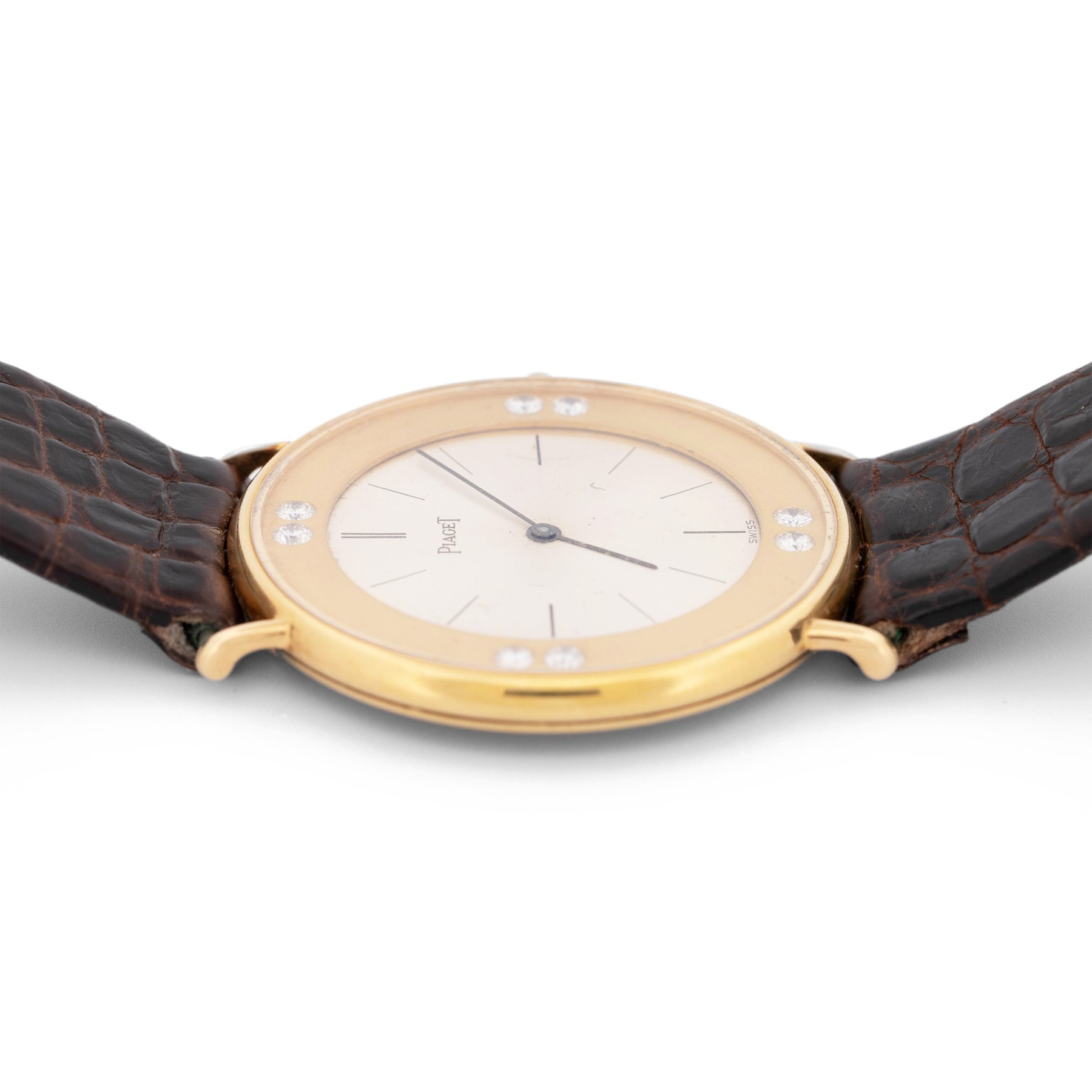 Piaget Altiplano ultra thin 18ct gold diamond set manual wind wristwatch, Ref. 2642, Cal. 20P2, silvered dial with baton hour markers, the gold outer ring set with eight round brilliant cut diamonds, on brown leather strap with Piaget 18ct gold buckle and 18ct gold diamond set spacer