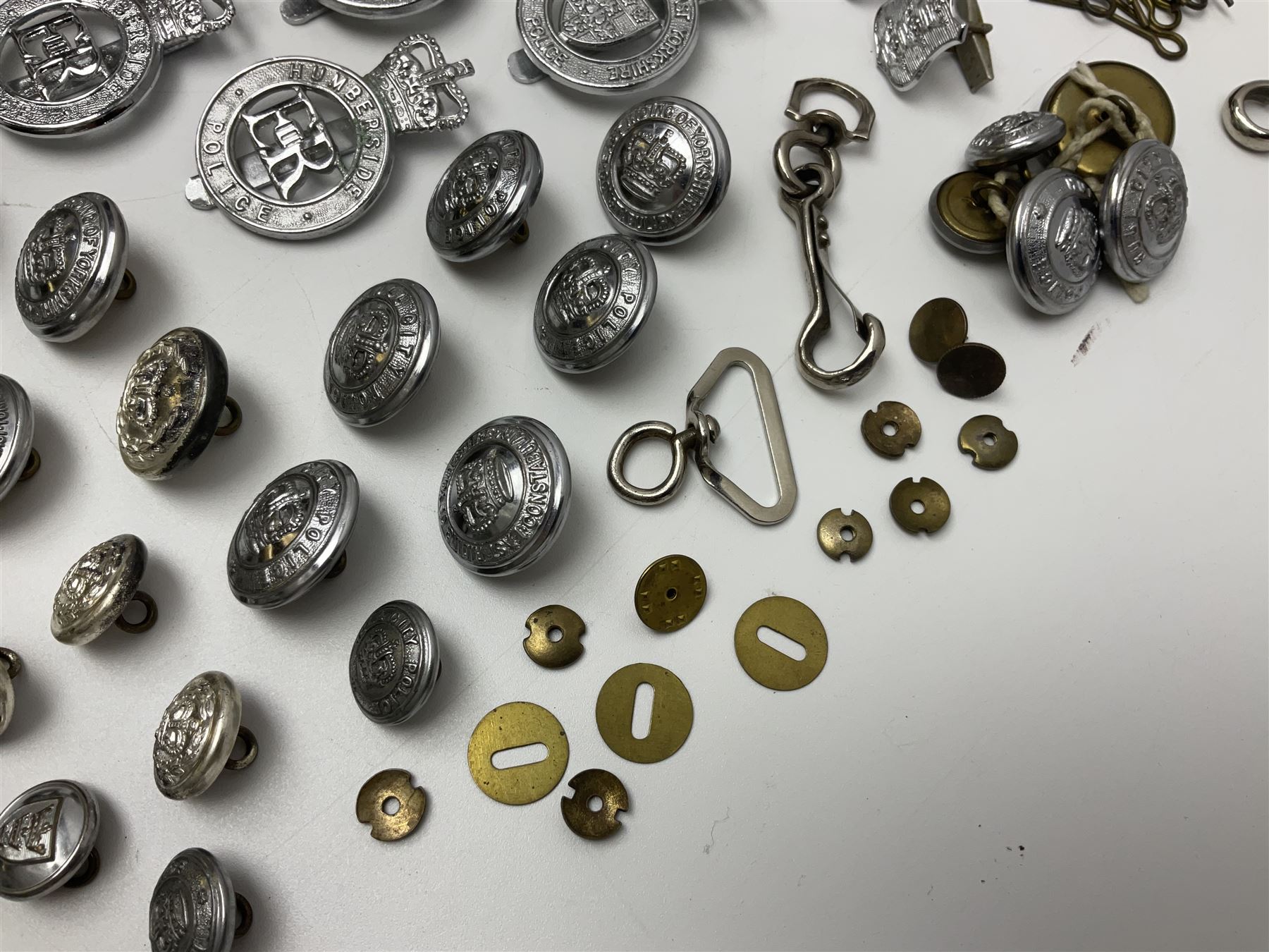 Police - large quantity of cap and collar badges, collar numbers and buttons for Hull City Police, Humberside Police, Lincolnshire Constabulary, York & North East Yorks Police etc; all queen's crown; and three helmet plates including one king's crown