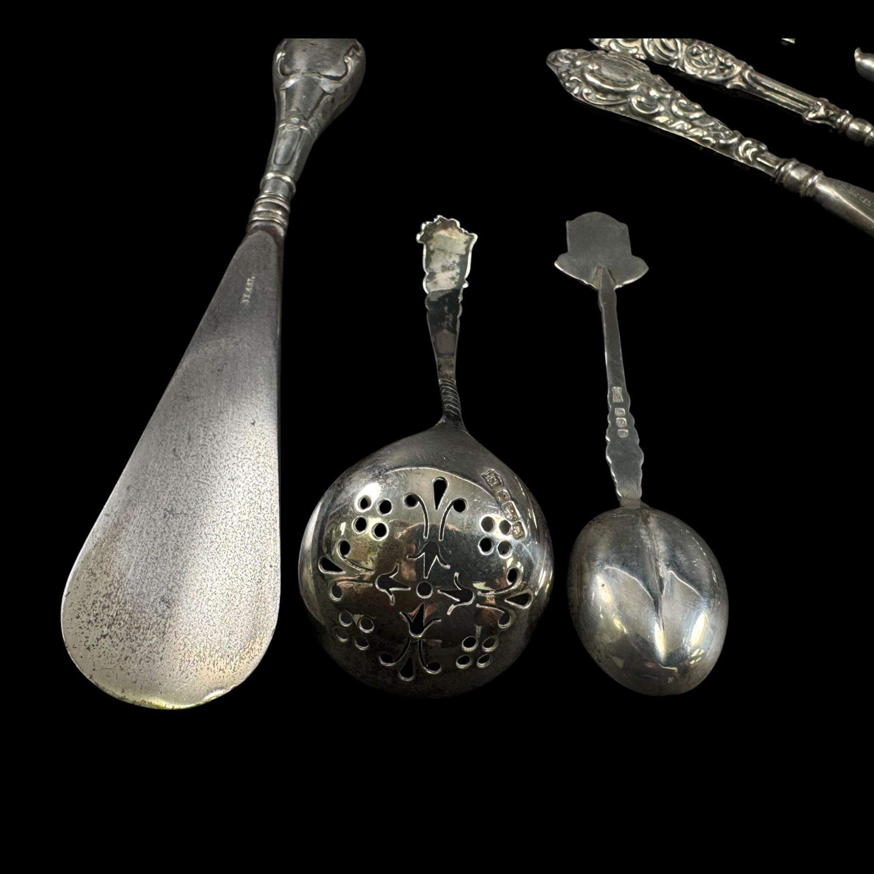 Silver handled button hooks and shoe horns, cut glass jar with silver lid, two silver spoons and an EPNS glass serving dish 