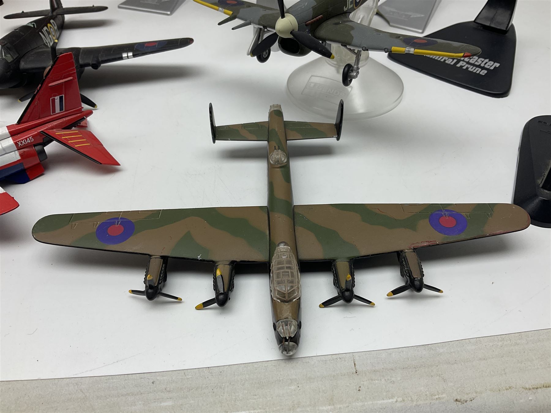 Thirteen unboxed Corgi Aviation Archive or similar die-cast models of aircraft, most with stands; Airfix 1:72 scale construction kit for BAe Harrier GR3; and two boxed Shell Collection die-cast models of cars