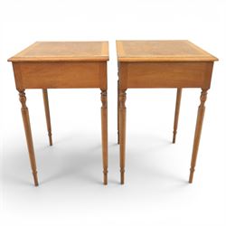 Traditional design pair of walnut lamp tables, figured top with crossbanded edge, above a single frieze drawer with brass oval handles, raised on turned supports