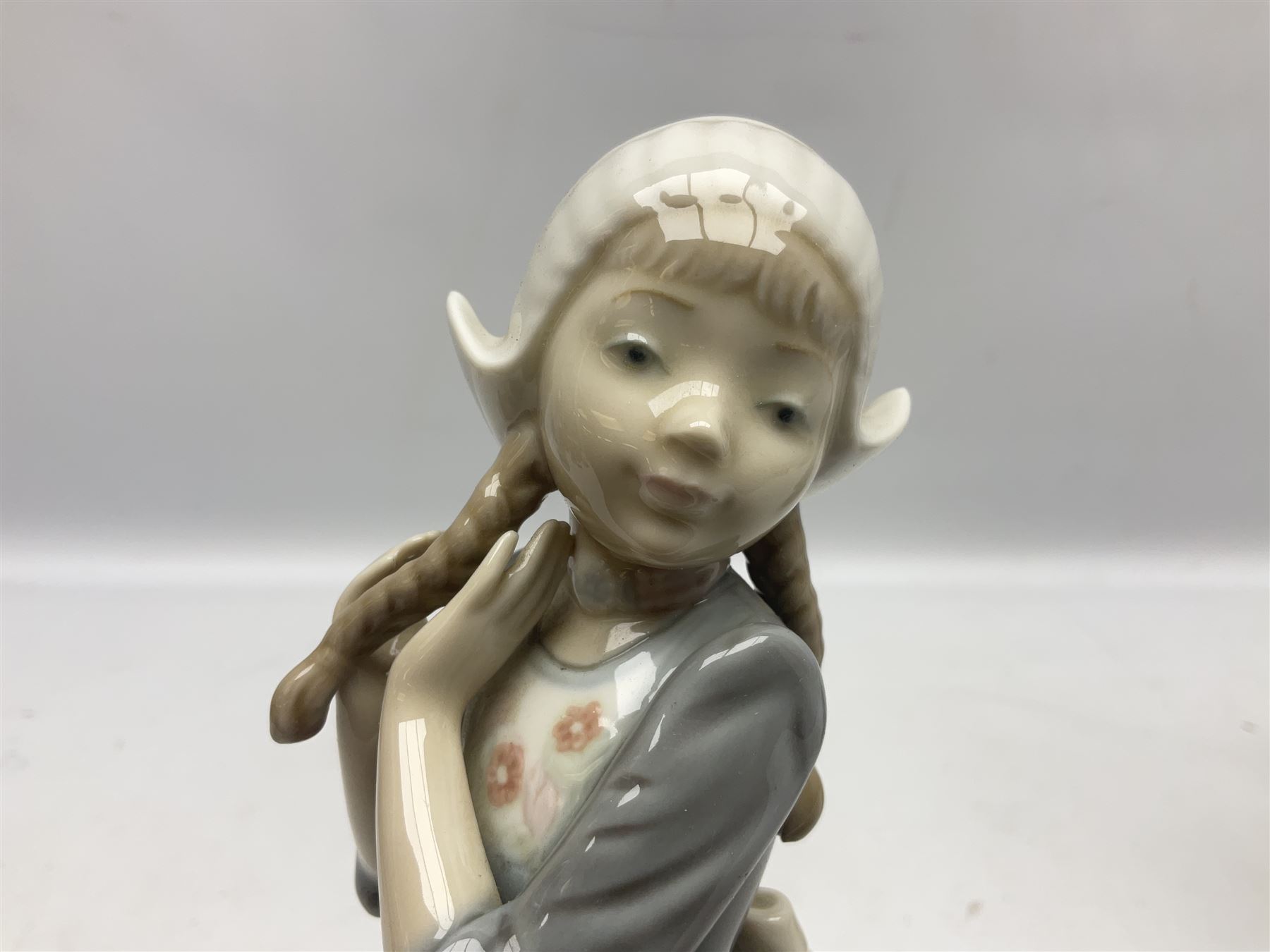 Three Lladro figures, comprising Dutch Girl with Braids no 5063, Dutch Girl with Duck no 5066 and Aracely with Ducks, all with original boxes, largest example H25cm