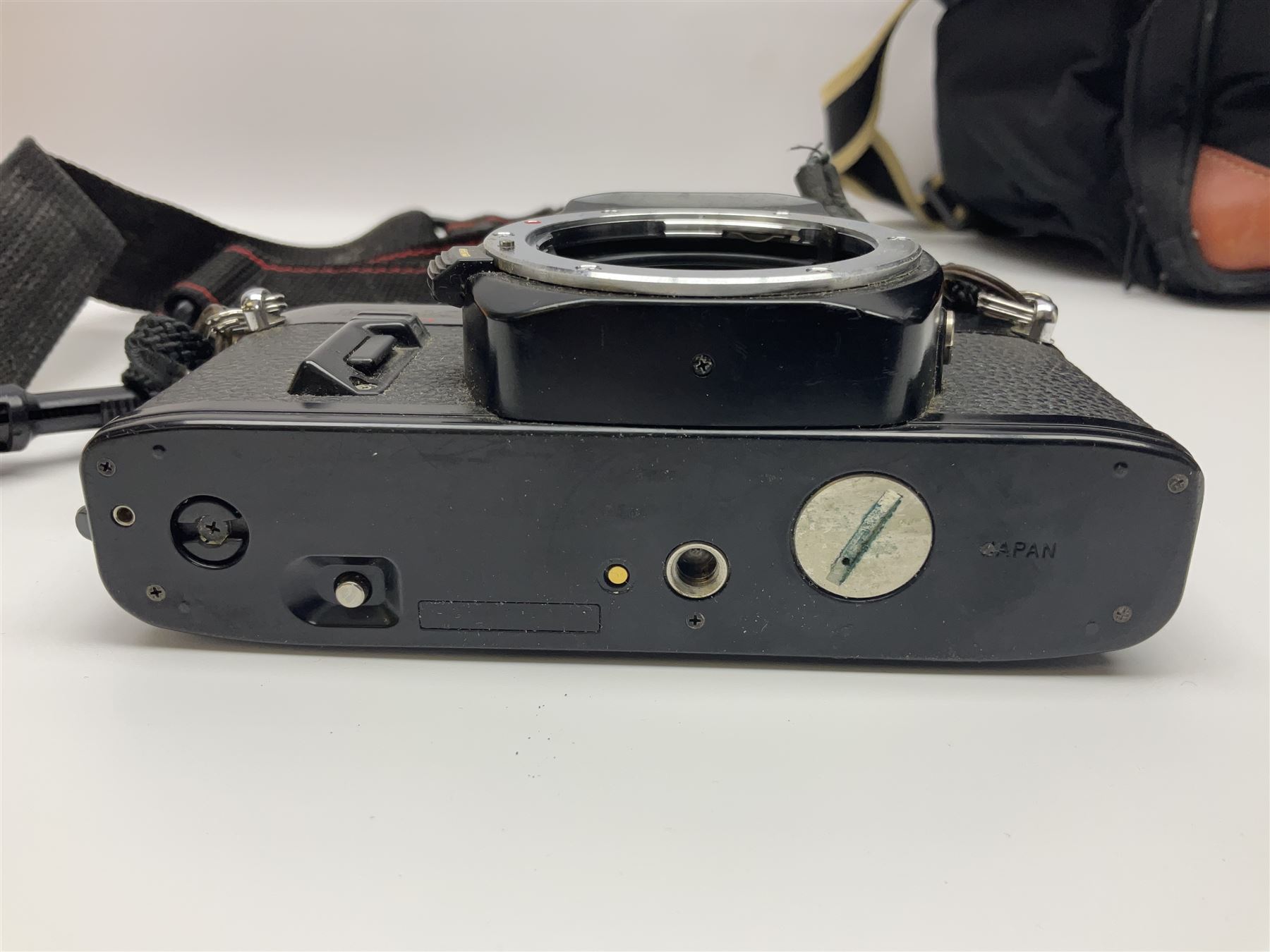 Four camera bodies, to include, Ricoh KR-10 serial no. 38826, Pentax MZ-M serial no. 4185969 with 'SMC Pentax- M 1:3.5 28mm' lens, Canon EOS500 serial no. 080927, with 'Sigma Zoom 100-300mm 1:4.5-6.7 DL'  lens etc, with other camera lenses and equipment 