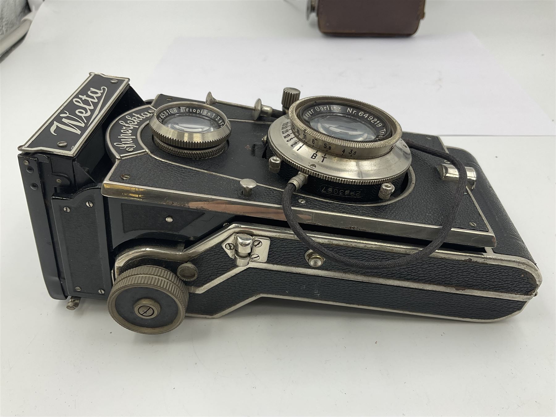 Welta Superfekta Folding twin lens camera, with 'Meyer Gorlitz Trioplan 1;3.8 f=10cm' lens serial no 649219 and 'Meyer Gorlitz Trioplan 1;3.8 f=7.5cm' lens serial no 653168, in fitted case