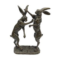 A bronze figure group, modelled as two male hares boxing, upon a naturalistic base, with foundry mark, H27cm.