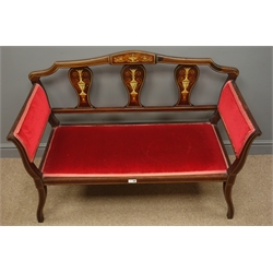  Edwardian inlaid mahogany two seat salon settee, upholstered in red fabric, shaped supports, W111cm, H80cm, D47cm  