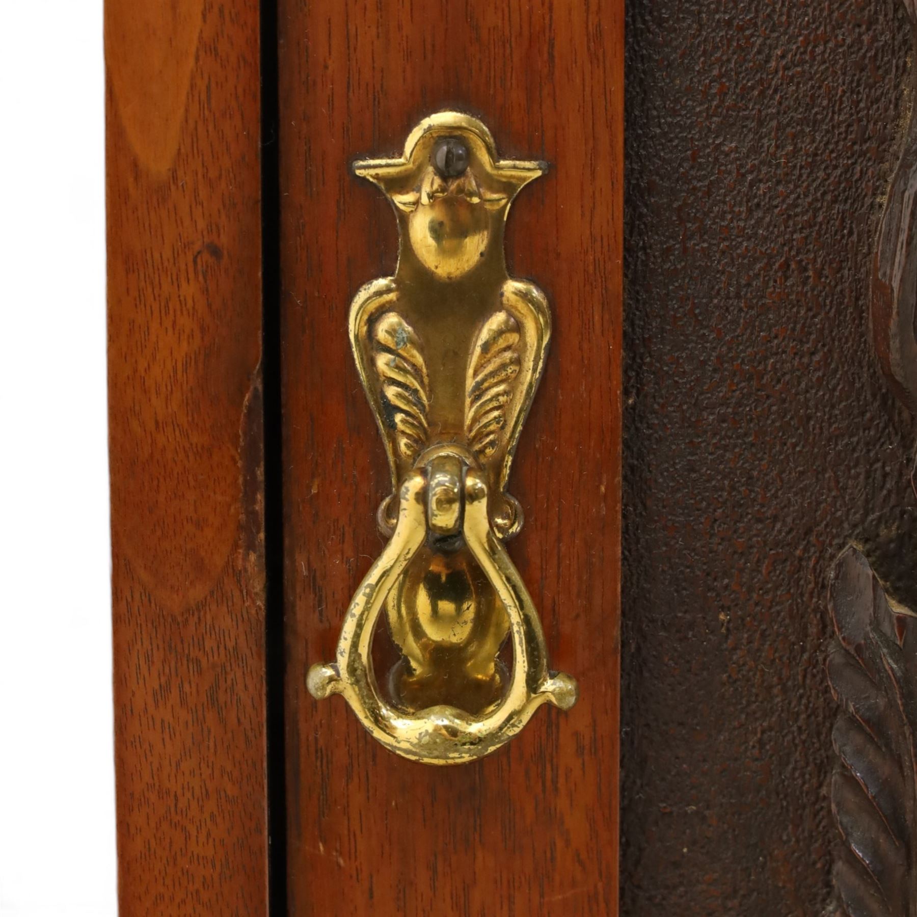Edwardian walnut hanging corner cabinet, single panelled door with applied carved foliate decoration enclosing shelf 
