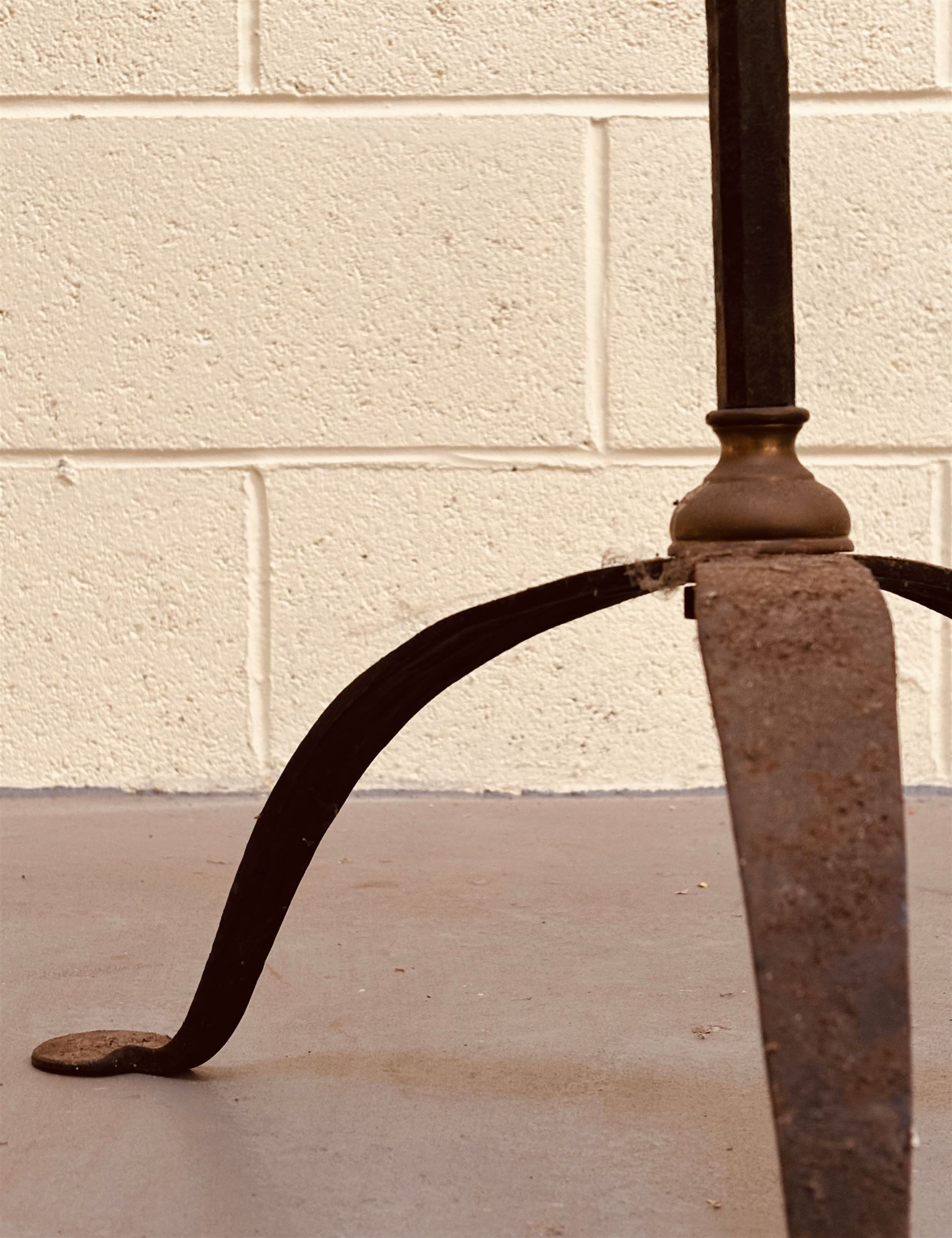 Brass mounted wrought iron two branch candle stand on a tripod base, possibly American. H162cm.  - COLLECTION BY APPOINTMENT FROM: The White House, Thirsk Road, Easingwold, York, YO61 3NF - CALL 01723 507111 TO ARRANGE