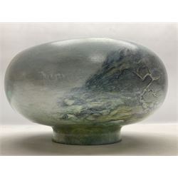 Wooden hand painted bowl, decorated with trees on a blue ground, signed Phil Crennell beneath, D28cm