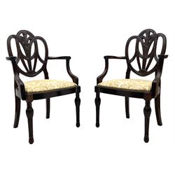 Set eight early 20th century mahogany Hepplewhite style dining chairs, the shaped fleur-de-lis feather carved back with linen swags and moulded frame, sprung drop in seats upholstered in gold floral pattern fabric, on turned acanthus carved and reeded supports, the carvers with shaped moulded arm supports and flower head carved terminals