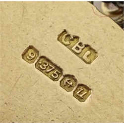 9ct gold curb bracelet with heart locket hallmarked,  with ten 9ct gold charms including stork carrying a baby, house, first aid box and an 18ct gold cross charm, all tested, hallmarked or stamped