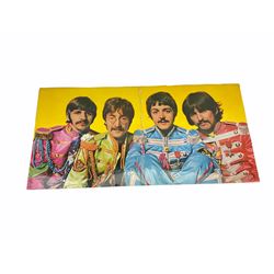 Mid 20th century Turkish film poster, 'Sevimli Mahkum' (After the Fox), H100cm L70cm, together with three other later posters, including one detailed 'Hair The America Tribal Love-Rock Musical', and a Beatles St Peppers Lonely Hearts Club Band vinyl record sleeve. 