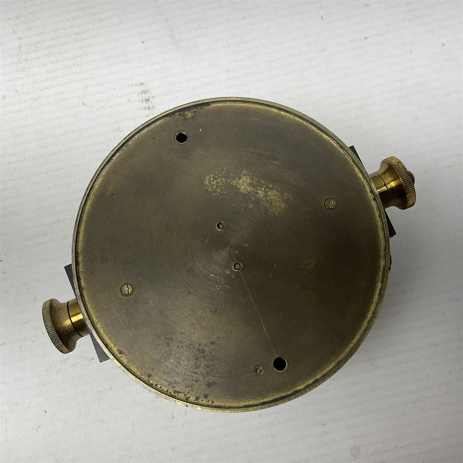 WWII British marching compass, the black lacquered brass case inscribed T.G.Co.Ltd. No.B100228 (broad arrow) 1941 Mk.III; and a ship's brass cased clinometer, the silvered dial marked R(arrow)L, D9cm; in leather carrying case (2)
