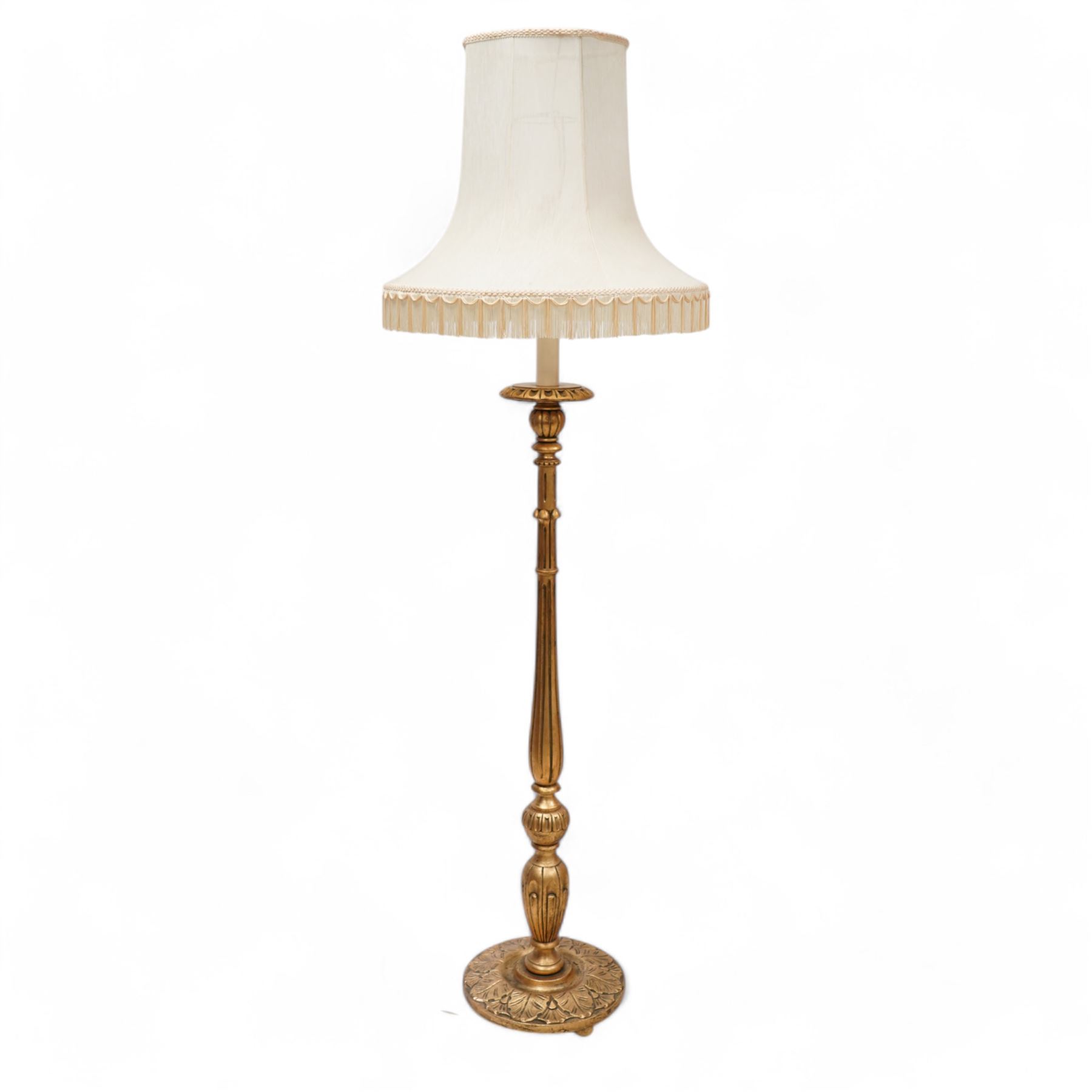 Italian design giltwood pricket stick standard lamp with shade, turned and fluted column on circular acanthus leaf carved base