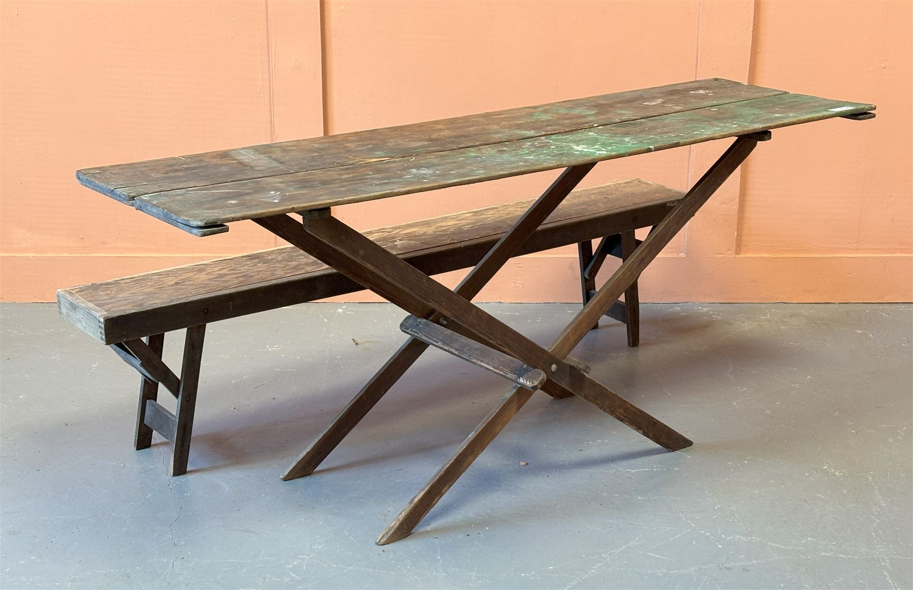 Early 20th century pine trestle table, the hinged top on a folding 'X' frame base. (H79cm, 181cm x 55cm) together with a folding pine trestle bench (L181cm) - COLLECTION BY APPOINTMENT FROM: The White House, Thirsk Road, Easingwold, York, YO61 3NF - CALL 01723 507111 TO ARRANGE