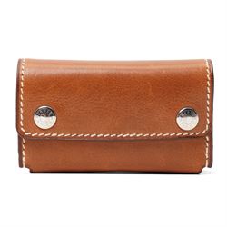 Hermès - ‘Mini-Dominos In-the-Pocket’ game, comprising miniature domino set in tan leather...