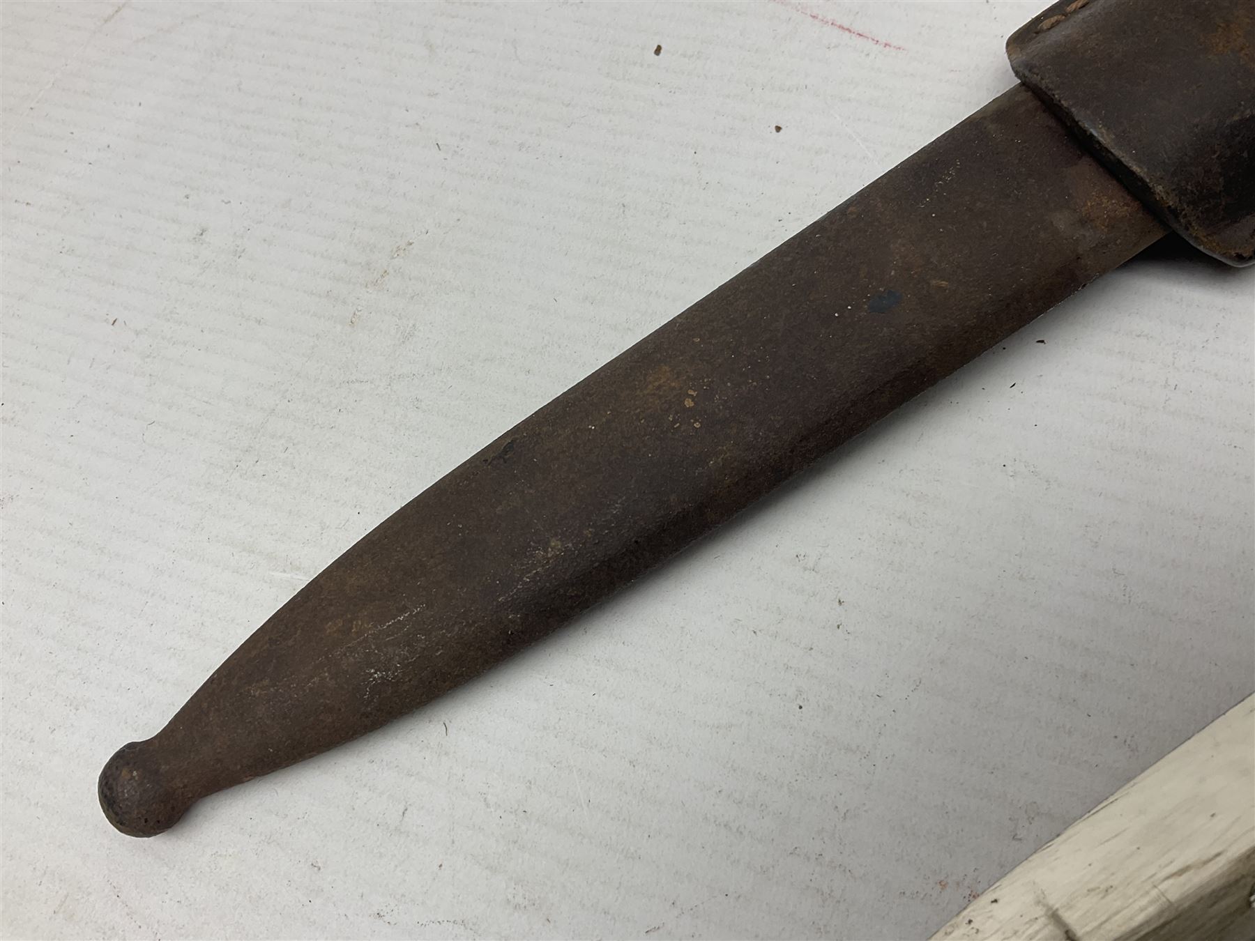 WWII German K98 (short) NCO dress bayonet, the 20cm fullered blade marked Anton Wingen Solingen to the ricasso, with chequered black grip plates; in steel scabbard with indistinctly stamped leather frog |L37cm overall