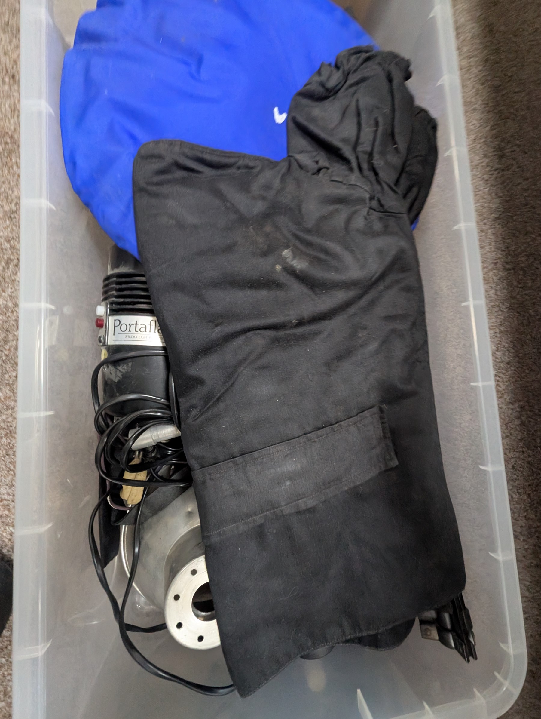 Collection of photography equipment, including cases, tripods, screens, guillotine, lighting etc