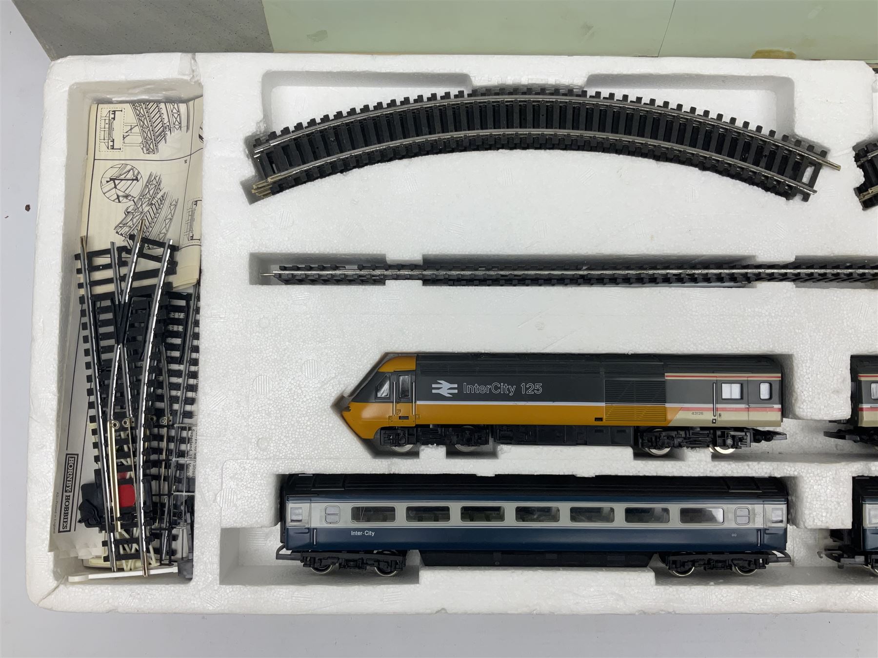 Hornby '00' gauge - Intercity 125 2-car set Nos.43010 & 43011 with one coach in original box with track and additional 4-6-0 locomotive and tender No.7476 and goods wagon; and another similar HST Intercity 125 2-car set Nos.43125 & 43126 with two coaches in original box with track and controller (2)