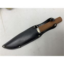 Reproduction non-firing flintlock pistol with brass skull crusher butt, the lock-plate inscribed 'Tower' and 'GR' L40cm; Sabre Japan Original Bowie Knife in sheath; and Indian embossed nickel two-piece walking cane (3)