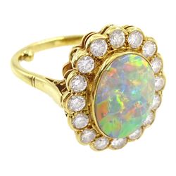 18ct gold oval opal and diamond cluster ring, hallmarked, opal approx 13.5mm x 10mm, total diamond weight approx 1.00 carat