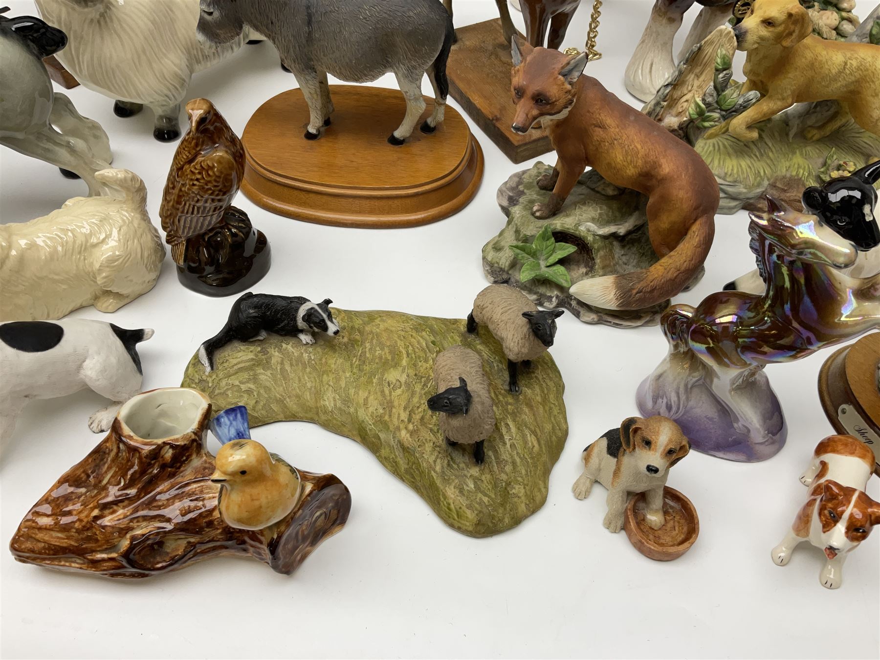 Beswick pigeon no 1383 and a collection of other ceramic animal figures including Campsie Ware lustre budgies, Kowa red fox and Labrador, two shire ponies, two sheep, etc 