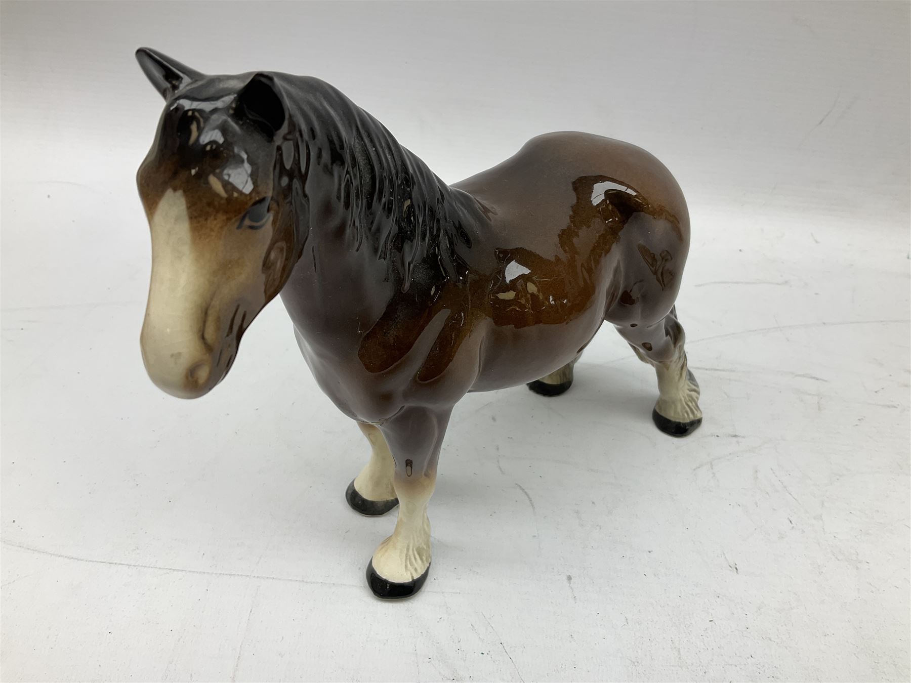 Seven Beswick figures of horses, including Connemara pony in grey no.1641, Arab in bay no.1265, large foal in grey no.947 etc, together with a Goebel figure of a horse (8)