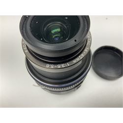 Olympus E-520 camera body, serial no. G27518842, with 'Olympus Zuiko Digital 14-42mm 1:3,5-5,6' lens, serial no. 212656796, Olympus E P1 camera body, serial no. H46518215, with 'Panasonic Lumix G1:2.5/14ASPH' lens, Olympus Pen Lite E-PL5, serial no. BFU507430, with 'Panasonic Lumix G 1:1 7/20 ASPH' lens, together with a collection of Olympus lenses, to include 'Olympus Zuiko Digital 25mm 1:2.8' lens serial no. 292017627, 'Olympus Zuiko Digital 9-18mm 1:4-5.6' lens, serial no. 300204427 