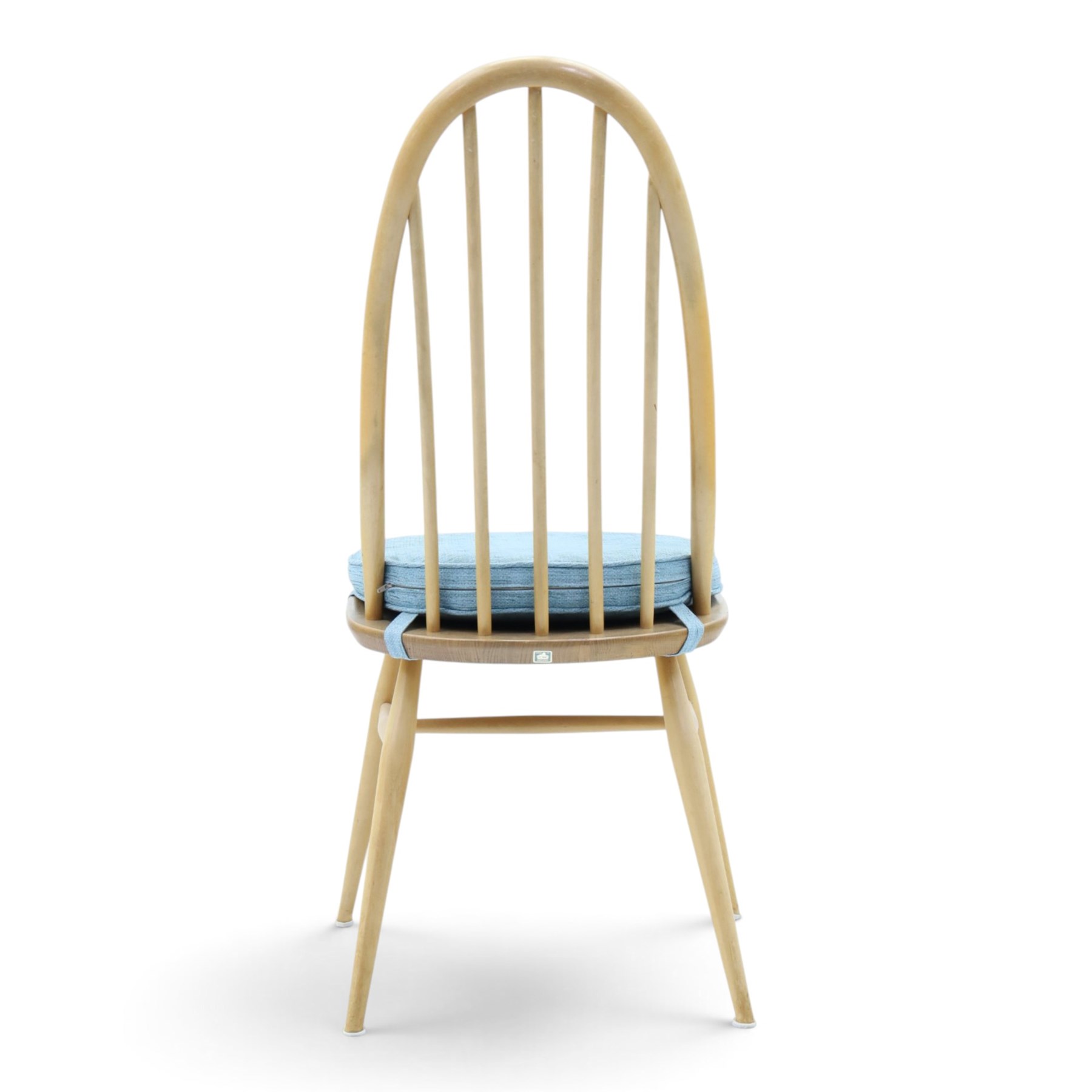Ercol - set of four 'Quaker' dining chairs, with high hooped back, blue seat cushions with studded, tapered supports  