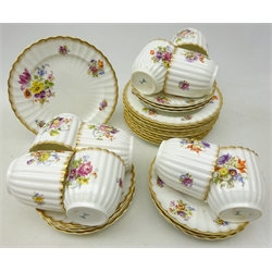  Set of nine early 20th century Bishop & Stonier trios, of ribbed form, decorated with floral sprays and gilded rim, comprising 11 saucers, 9 tea cups and 10 plates   