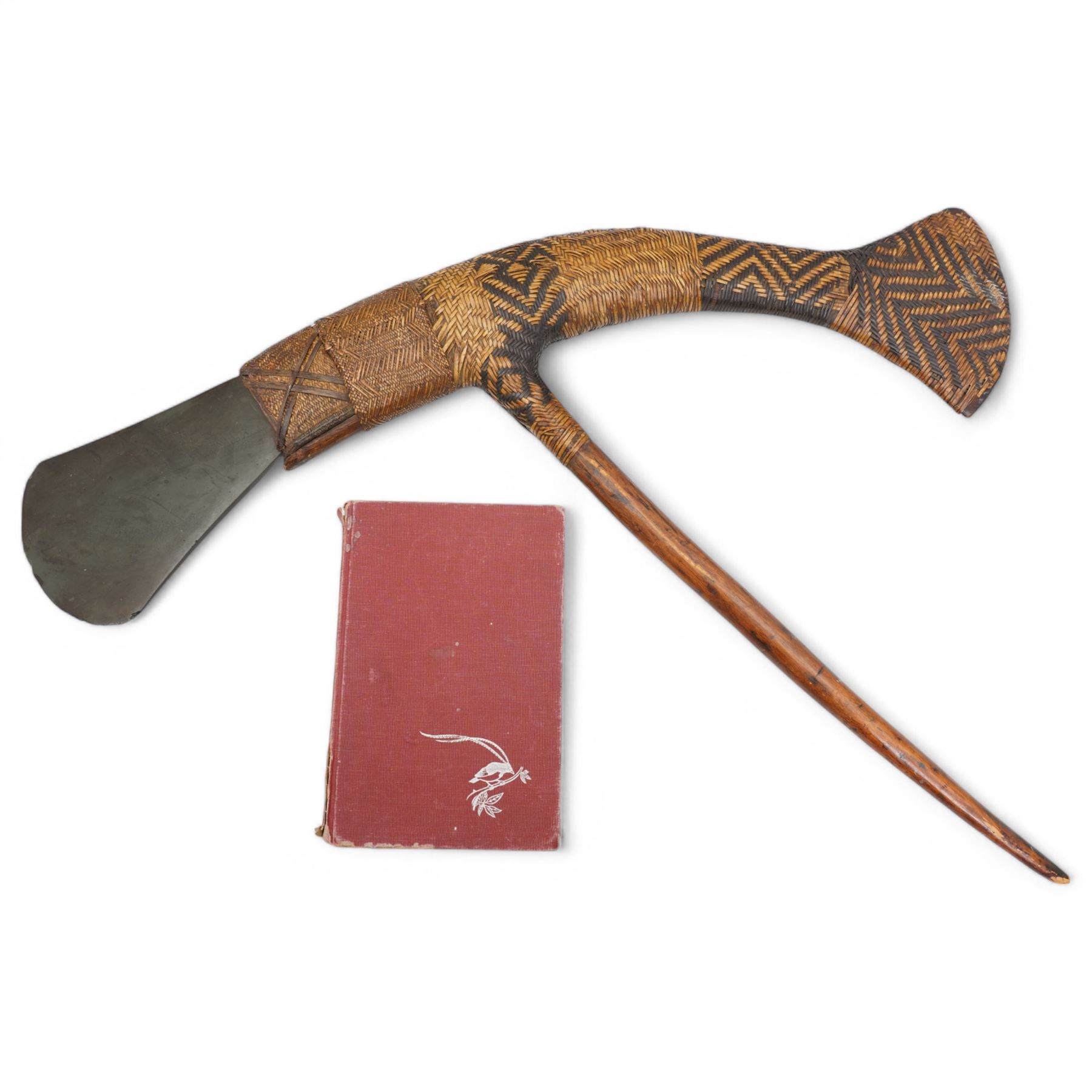 Papua New Guinea presentation ceremonial axe with greenstone head, with intricate fibre binding and wooden haft 77cm across together with a signed copy of Colin Simpson's book 'Adam in Plumes' in which the axe is illustrated 1954