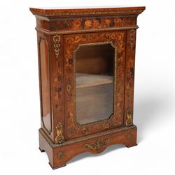 Victorian walnut and gilt metal mounted pier cabinet, rectangular top over acanthus leaf moulded gilt metal edging and floral inlaid frieze, single glazed door inlaid with scrolling leafage and flower heads, fitted with single internal shelf, egg and dart moulded lower edge over shaped skirt base 