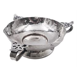Arts & Crafts silver bowl, the planished bowl of circular form with three lips to rim, and three flower head capped curved handles, upon a circular spreading foot, hallmarked Charles Edwards, London 1904, 5.5cm D13cm, approximate weight 8.81 ozt (274 grams)