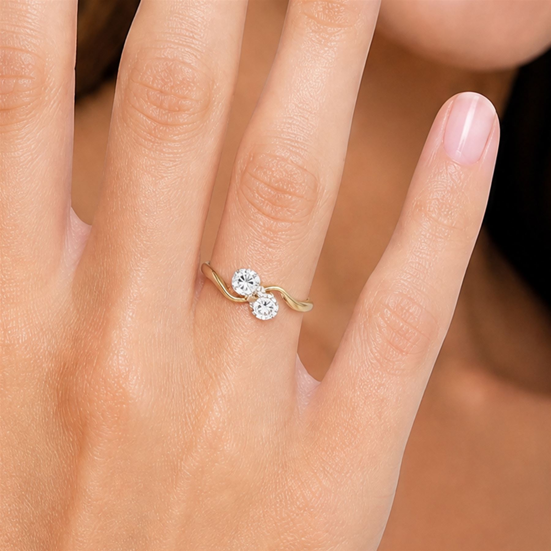 18ct gold diamond ring, crossover set with two round brilliant cut diamonds, Birmingham 1966, total diamond weight approx 0.30 carat